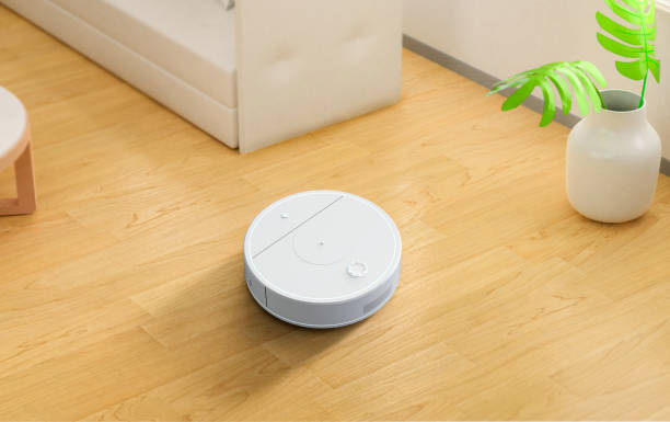 istock Robotic cleaner or sweeper on wooden floor 1931599057