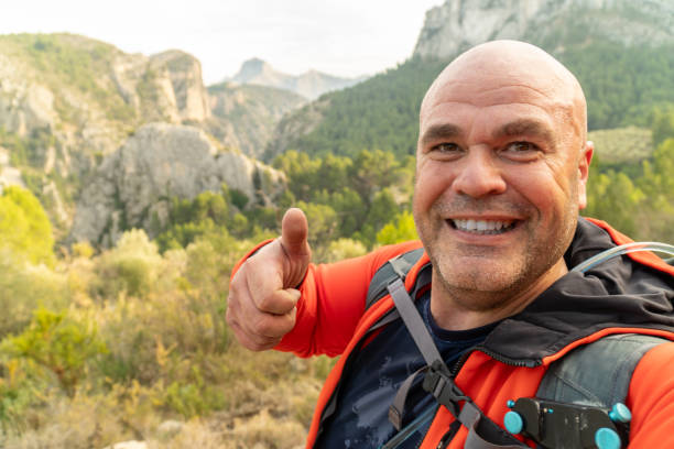 istock hikker takes a photo selfie on the mountains 1931755681