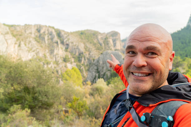 hikker takes a photo selfie on the mountains