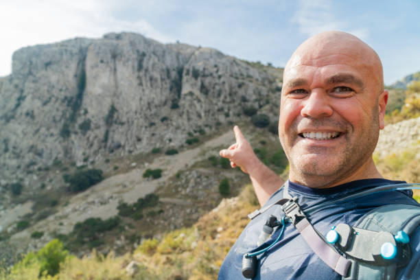 istock hikker takes a photo selfie on the mountains 1931755697