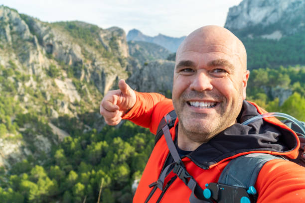 istock hikker takes a photo selfie on the mountains 1931755904