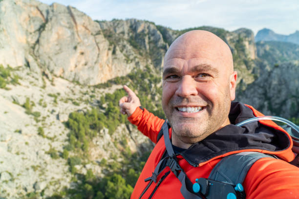 istock hikker takes a photo selfie on the mountains 1931756151