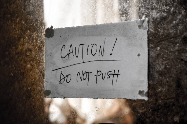 istock paper with the warning Do not push attached to a glass. 1931801025
