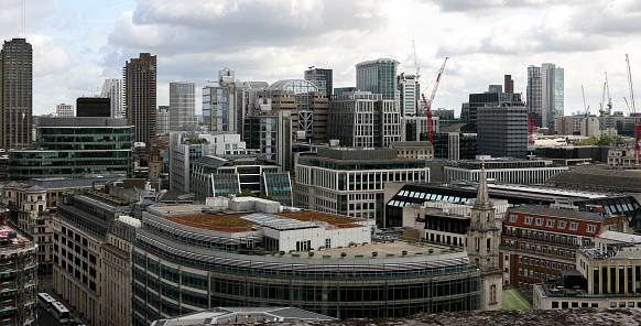 Dense view of urban London populated with corporate office buildings and residential buildings - London, England, UK