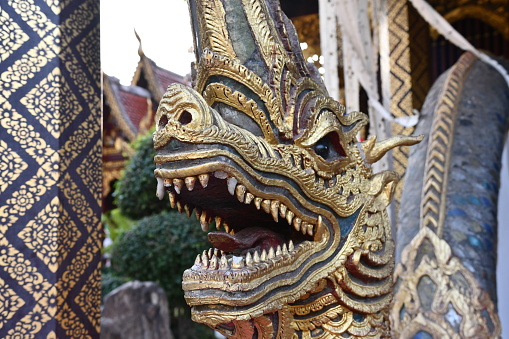 Dragon sculpture in a temple with gold ornementation