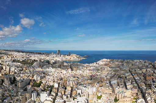 Discover the lively city of Sliema, Malta, from above, showcasing a bustling urban landscape in this vibrant Mediterranean hub.