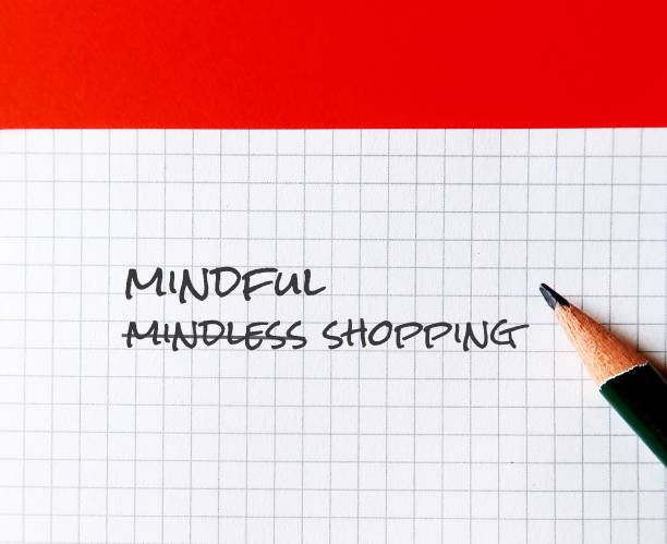 istock Note paper on orange background with handwritten text MINDLESS SHOPPING, changed to MINDFUL SHOPPING, to overcome impulsive purchase to more conscious thought of what we plan to buy 1931886074