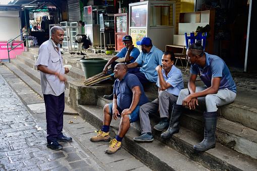 Port Louis, Mauritius - October 25 2023: Workers taking a Break at the Central Market.