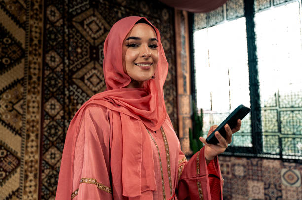 istock Beautiful young woman wearing colored abaya 1931905702