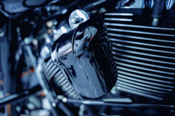 Parked black retro styled Harley Davidson motorbike standing in parking lot area if Nawamin Avenue City in Bangkok Nawamin which is a mix of shopping stores, supermarket, restaurants and bars