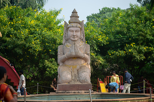 Mumbai, India - 20 November 2023, Statue of Buddhist god at Pagoda Vipassana Centre. Dalai Lama, Buddhism, spiritual, yakshini, namaskar, lumbini, pilgrimage, spiritual, garden, people, Garuda, Tibet