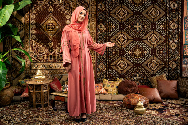 istock Beautiful young woman wearing colored abaya 1931925764