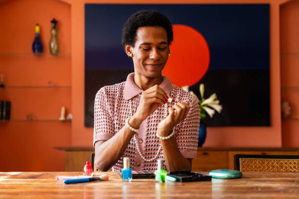 Fluid gender young man at home, LGBTQ and diversity concepts