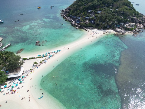 Koh Nang Yuan consists of two small islands covered in jungle and studded with granite boulders, and connected in the middle by a thin strip of white sand
