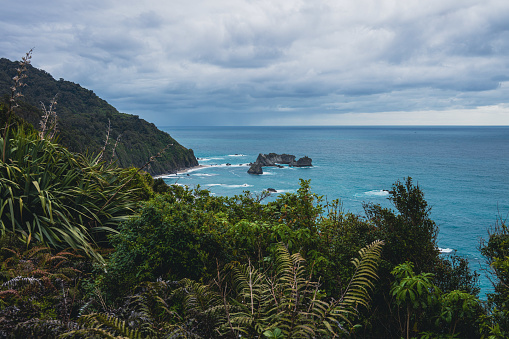 Explore the mesmerizing ocean rocks at Knights Point Lookout in New Zealand, where nature's rugged beauty meets the powerful sea.