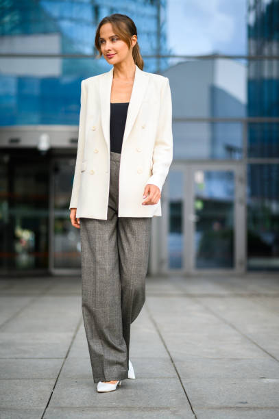 istock Confident young female manager outdoor walking in a modern urban setting 1931993379