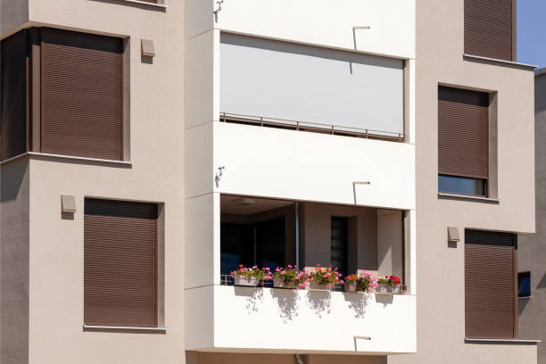 istock Window Blinds and Balcony Shutters of Modern Facade Apartment Building 1932002372