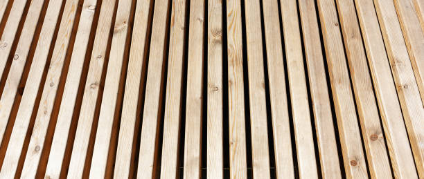 istock Wooden outdoor bench texture background close up 1932002922