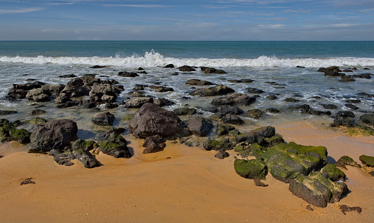 Scenic view of surf pounding rocky headlands