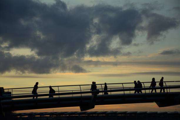 istock People silhouette on Millennium Bridge, London. 1932055565