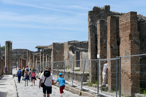 Pompei, Italy - may 25, 2016 -:Turists visit ruins of Pompei, an ancient city buried by the 79 AD eruption of Mount Vesuvius. The ruins of Pompeii are part of the UNESCO World Heritage Sites