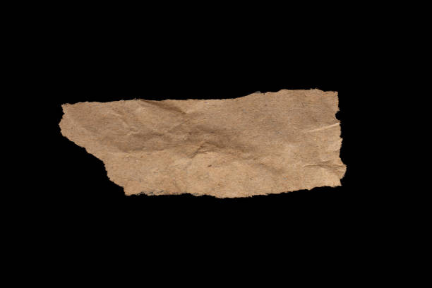 istock Ripped brown paper piece isolated on black background 1932134666