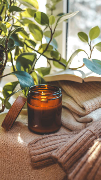istock Burning candle in a cozy home interior 1932155417