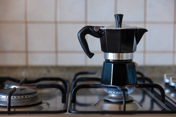 istock Making coffee with moka pot in the kitchen 1932158150