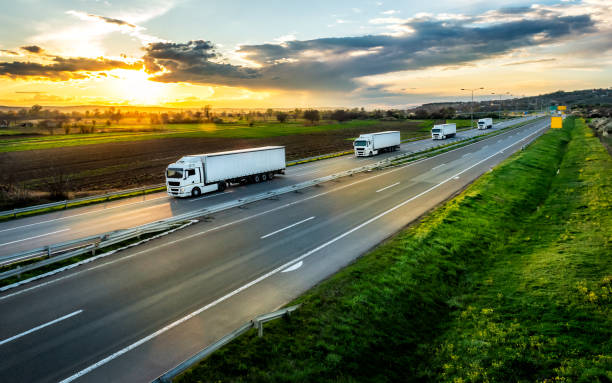 istock Convoy or Fleet of white trucks 1932168694