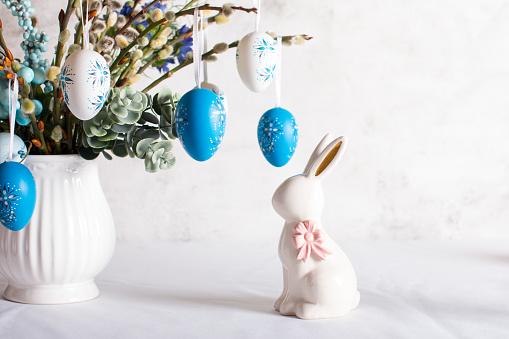 Closeup shot of Easter bunnies and and flowers. Happy Easter. Easter background image.