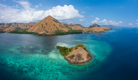 Kelor island in blue sky sunny day, Komodo national park, Indonesia