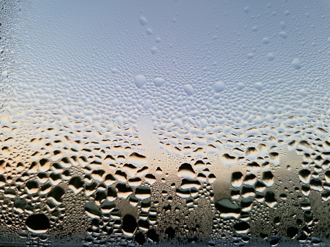 Rainy night, raindrops on the glass