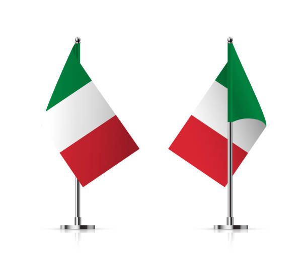 istock Flags of Italy on pole vector illustration. 3D realistic flagpoles on mini steel vertical stands, isolated desktop flagstaff, green, white and red italian flags with stripes on metal sticks 1932219727