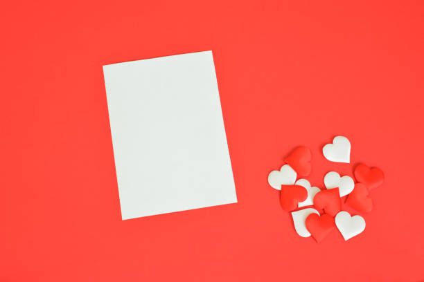 istock greeting card with red background decorated with paper hearts 1932241117