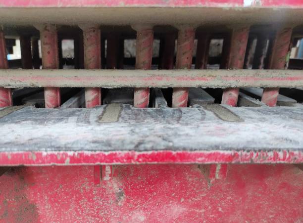 concrete brick making press machine - metal rusty rust steel imagens e fotografias de stock