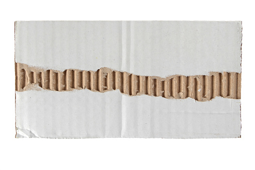 Scrap of white recycled cardboard box isolated on white. Grunge packing paper design element. Shabby rectangular fragment of shipping container.
Torn corrugated carton piece.