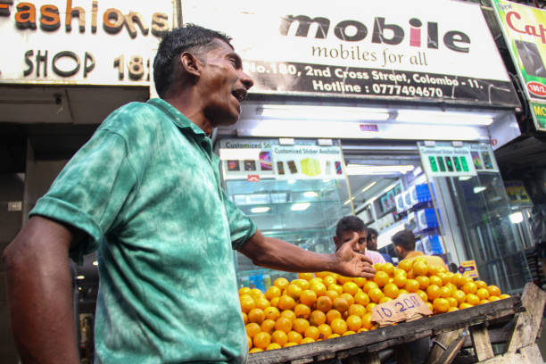 A steet seller selling oranges on 24th of December (christmas eve)day