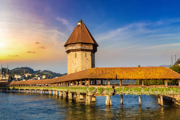 Famous Chapel bridge in Lucerne Famous Chapel bridge in Lucerne in a beautiful summer day, Switzerland lucerne switzerland stock pictures, royalty-free photos & images