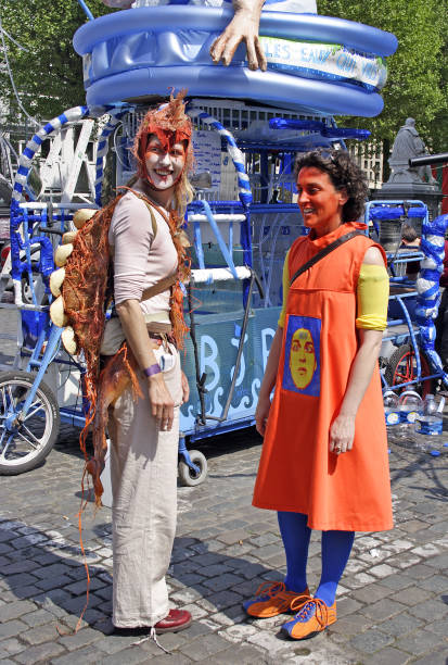 Unidentified participants with colored face plays in scene during Zinneke Parade on May 13, 2006 in Brussels, Belgium. This parade is a biennial free-attendance artistic event