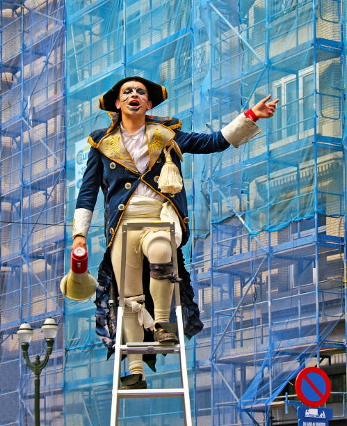 Unidentified participants with colored face plays in scene during Zinneke Parade on May 13, 2006 in Brussels, Belgium. This parade is a biennial free-attendance artistic event