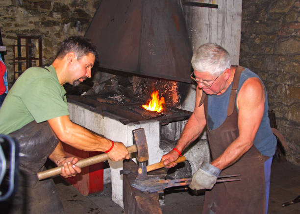 In front of a furnace, Steel burning process, forging the iron steel sword, Close up of burning wood fire in blacksmith furnace