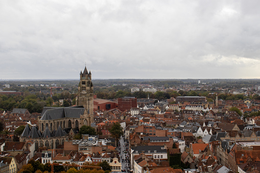Breathtaking panoramic view from the Belfry of Bruges, capturing the city's red-roofed houses and the iconic Sint-Salvatorskathedraal