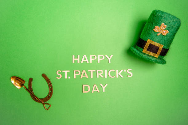 istock Horizontal banner with Happy St. Patrick lettering on green isolated background with leprechaun hat 1932311111