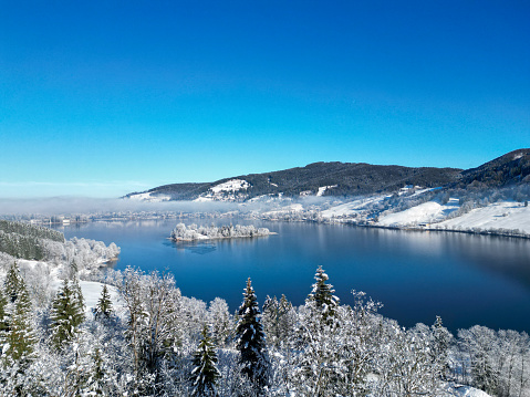 Aerial view on winter landscape at Lake Schliersee in the Alps