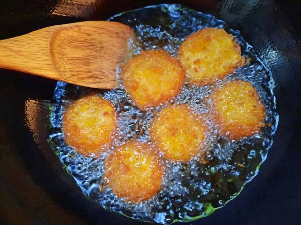 istock Cooking Shrimp Cakes - Thai Food preparation. 1932409324