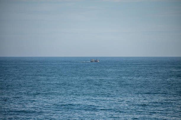 istock Trawler seen traveling along coast 1932409894