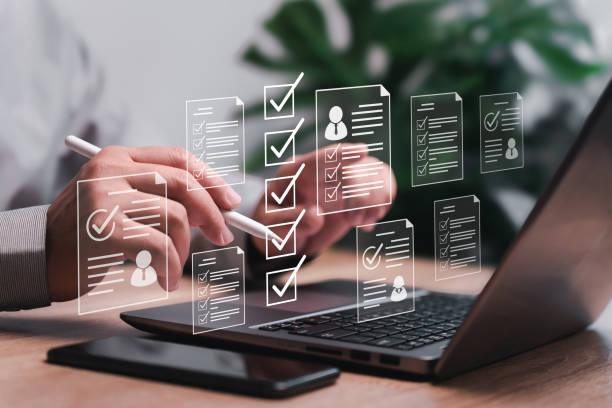 istock HR Management Human Resources document online checklist concept, Businessman search online of best Human Resources for employees to select the qualities of the best people to join the team 1932440211
