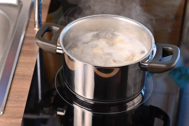 istock Boiling water in a pan on a hot electric stove. 1932495263