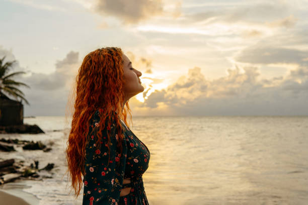 istock Woman breathing fresh air at sunset 1932501188