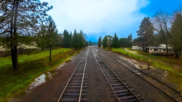 istock a scenic shot looking down the tracks on a cloudy day 1932509156